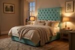 The Chesterfield Headboard in soft aqua green in a warm evening bedroom