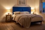 The Orlando Headboard in royal blue in a warm evening bedroom
