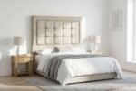 The Oslo Headboard in stone beige in a bright modern bedroom