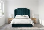 The Ruby Headboard in dark teal in a bright modern bedroom