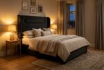 The Sapphire Headboard in charcoal black in a warm evening bedroom